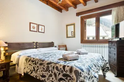 Cama o camas de una habitación en Arties Luxury Apartments - Parking y Guardaski en Vall de Ruda