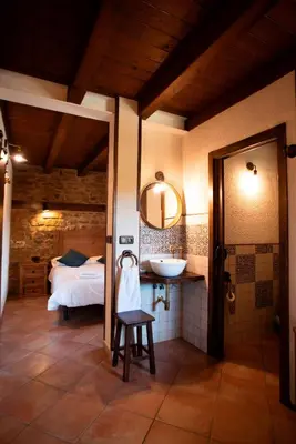 Cama o camas de una habitación en L'Olivera - BENABARRE