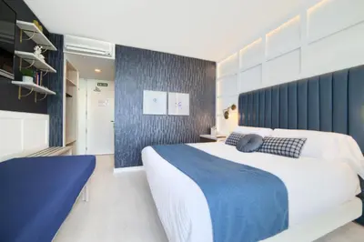Cama o camas de una habitación en Hotel Luze El Villa