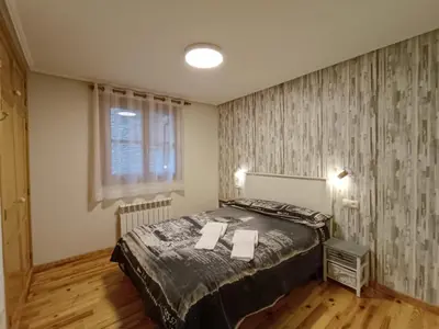 Cama o camas de una habitación en Apartamento Oreja de Oso Benasque Inmocyma