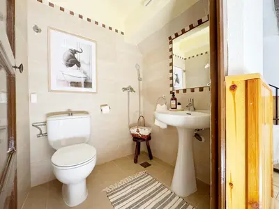 Un baño de Casa OPECHS