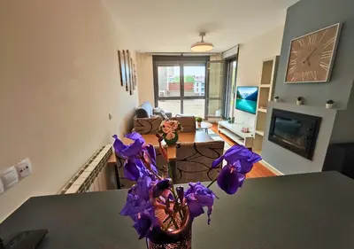 Una televisión o centro de entretenimiento en Apartamento Balaitús: Las Margas Golf