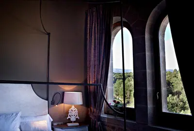 Cama o camas de una habitación en La Vella Farga Hotel