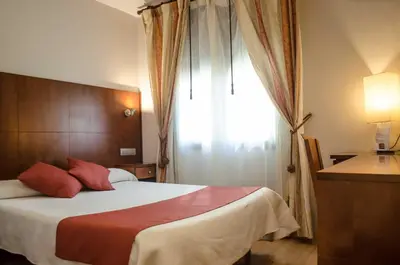Cama o camas de una habitación en Hotel Jaqués