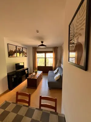 Una televisión o centro de entretenimiento en Apartamento Pasarelas Ventanal