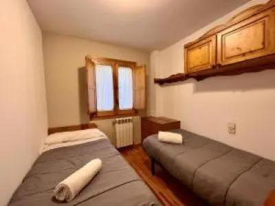 Cama o camas de una habitación en Hotel Avenida Benasque