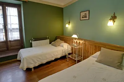 Cama o camas de una habitación en Hotel Avenida Benasque