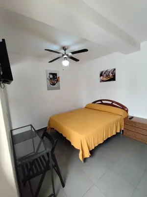 Cama o camas de una habitación en Hostal Castilla