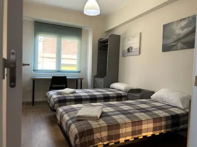 Cama o camas de una habitación en Aparts Zentrum Barrioverde