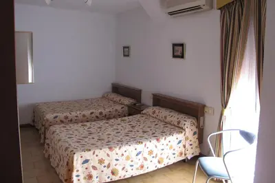 Cama o camas de una habitación en Hostal Casa Pepe