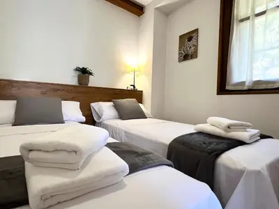 Cama o camas de una habitación en Apartaments Casa Sastressa - L'Amfitriona