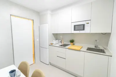 Una cocina o zona de cocina en Amplio apartamento a 5 min del centro de Pamplona