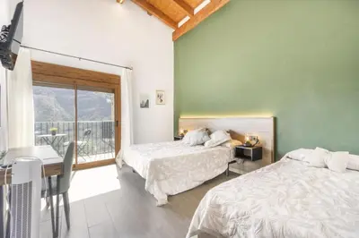 Cama o camas de una habitación en Cova Cuberes
