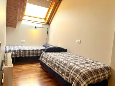 Cama o camas de una habitación en Apartament rústic amb encant i balcó by RURAL D'ÀNEU