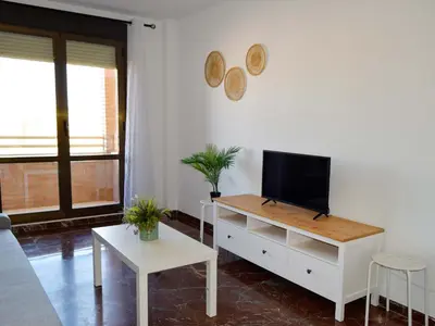 Una televisión o centro de entretenimiento en Apartamentos Zaragoza Suites El Pilar 3000