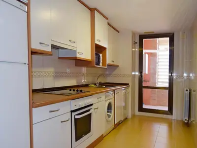 Una cocina o zona de cocina en Apartamentos Zaragoza Suites El Pilar 3000