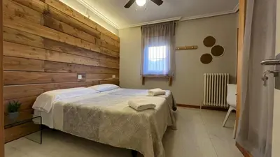 Cama o camas de una habitación en Hostal Ochoa