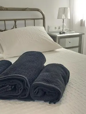 Cama o camas de una habitación en El Rincón de San Fermín