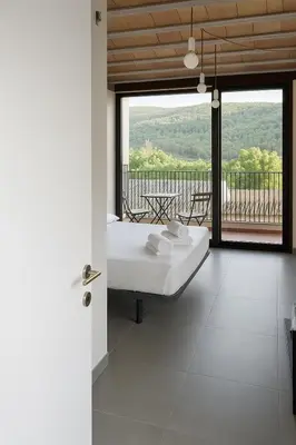 Cama o camas de una habitación en Hostal Boutique Restaurante El Algars