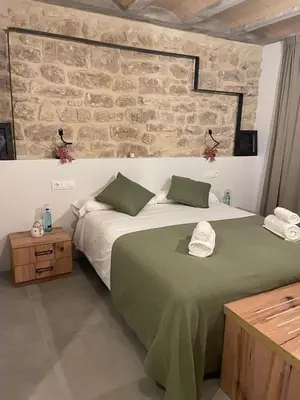 Cama o camas de una habitación en Hostal Boutique Restaurante El Algars