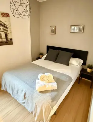 Cama o camas de una habitación en Tu Refugio en Zaragoza - Vive Zaragoza IX