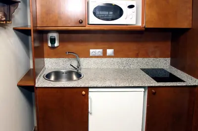 Una cocina o zona de cocina en Aparthotel La Vall Blanca