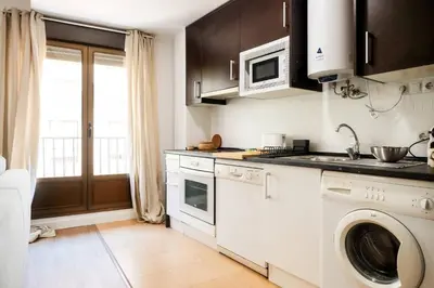 Una cocina o zona de cocina en Casa Cosmos Arcade WiFi 4 Huéspedes