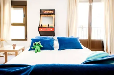 Cama o camas de una habitación en Casa Cosmos Arcade WiFi 4 Huéspedes