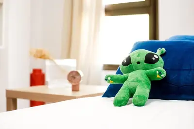 Cama o camas de una habitación en Casa Cosmos Arcade WiFi 4 Huéspedes
