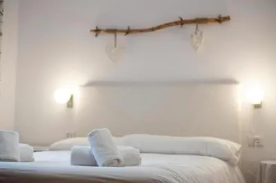 Cama o camas de una habitación en Casa Pelaire Panticosa -tucasaenlospirineos