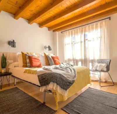 Cama o camas de una habitación en Apartament familiar de luxe i balcó amb vistes by RURAL D'ÀNEU