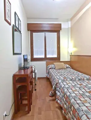 Cama o camas de una habitación en Pensión USOA