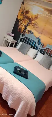 Cama o camas de una habitación en Hostal Urries Restaurante