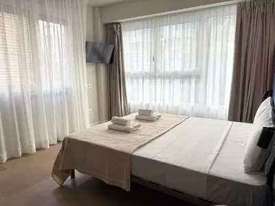 Cama o camas de una habitación en Groma Rooms