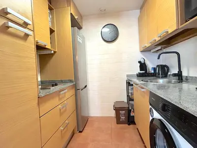 Una cocina o zona de cocina en Apartament encantador amb llar de foc by RURAL D'ÀNEU