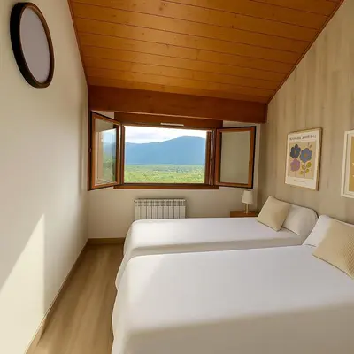 Cama o camas de una habitación en Vista Pirineos, wifi y petfriendly - Arafita Apartamentos