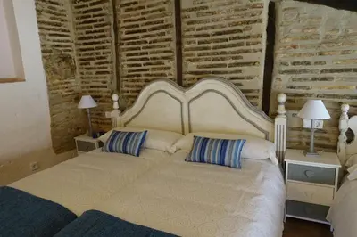 Cama o camas de una habitación en Apartamentos La Dama Azul