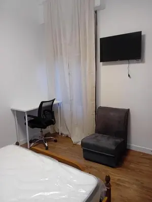Una televisión o centro de entretenimiento en Habitación Puerta del Carmen