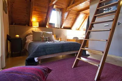 Cama o camas de una habitación en Casa Lola Pirene Chalet 12 Pax Sauna Jacuzzi Piano Vistas Vielha