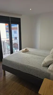 Cama o camas de una habitación en Apartamentos San Nicolas Jaca