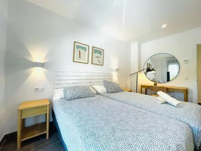 Cama o camas de una habitación en Apartamentos San Nicolas Jaca