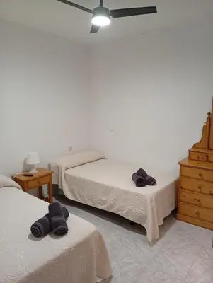 Cama o camas de una habitación en Alojamiento Cervantes