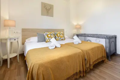 Cama o camas de una habitación en Mi trocito de Sabiñanigo, wifi y garaje