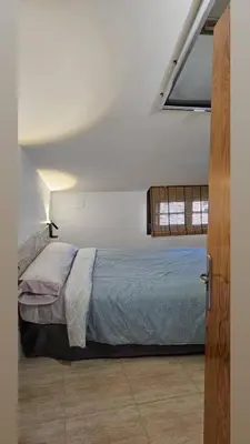Cama o camas de una habitación en Cozy attic apartment