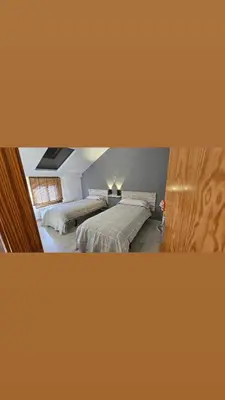 Cama o camas de una habitación en Cozy attic apartment
