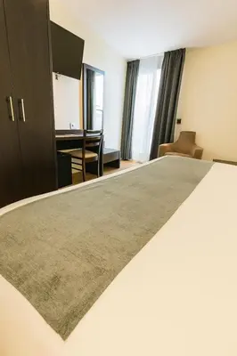 Cama o camas de una habitación en VTZ Hotel Plaza España