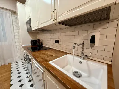 Una cocina o zona de cocina en Balcón de San Fermín impresionante exterior gran balcón 2 baños relax en el centro Hasta 8 personas