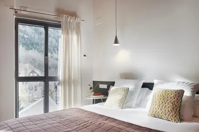 Cama o camas de una habitación en Val Arties 2 by FeelFree Rentals