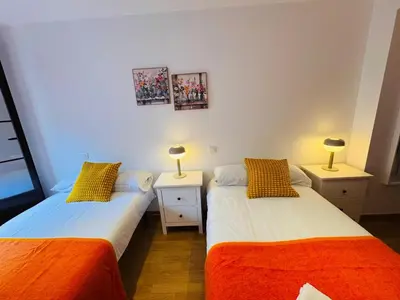 Cama o camas de una habitación en Magnifico alojamiento en el corazón de la ciudad Y CON GARAJE INCLUIDO