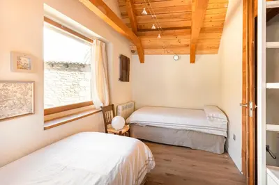 Cama o camas de una habitación en El Pajar de la Leña - tucasaenlospirineos
